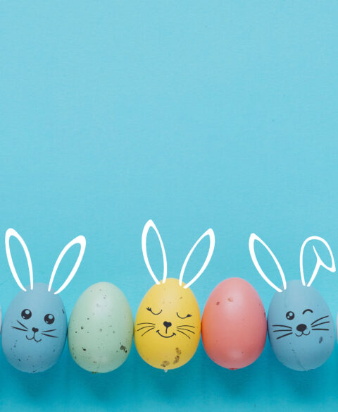 easter eggs with painted face copy space
